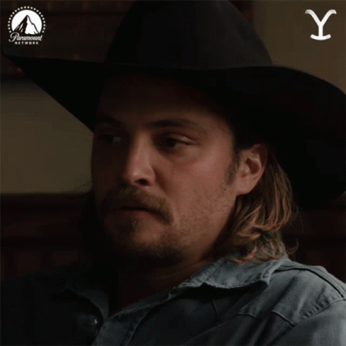 Man in Cowboy Hat With Paramount Logo
