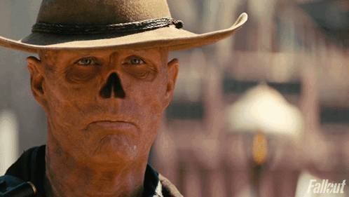 Man in Cowboy Hat With Skull on Face
