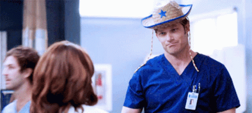 Man In Cowboy Hat With Star GIF