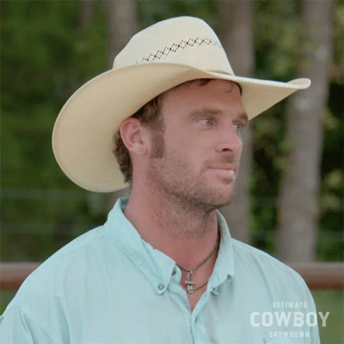 Man in Cowboy Showdown Shirt and Hat