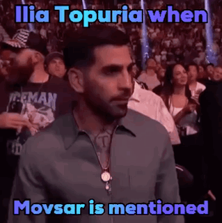 Man in Crowd Watching Boxing Match Saying Ilia Topuria When Movsar Is Mentioned