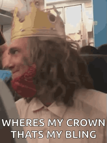 Man in Crown and Red Bandana on a Plane