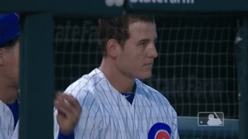 Man in Cubs Uniform Standing in Dugout