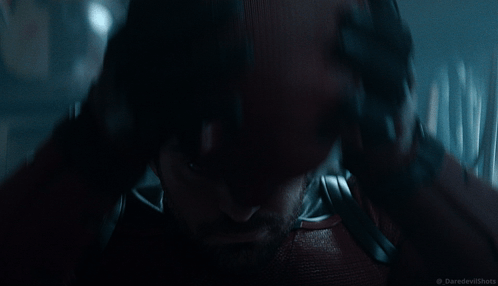 Man in Daredevil Costume Holding Head