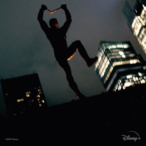 Man in Daredevil Costume Jumping