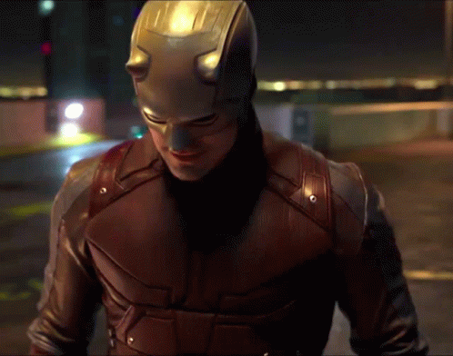 Man in Daredevil Costume Walking Night Street