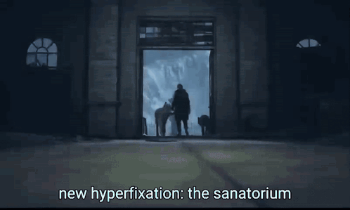 Man In Dark Room Saying New Hyperfixation The Sanatorium GIF