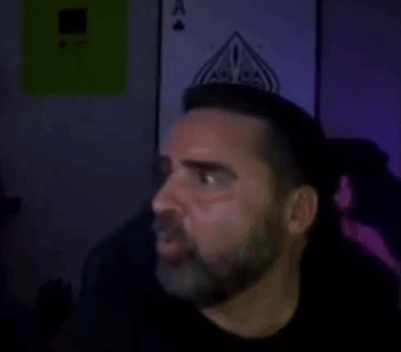 Man In Dark Room With Bayonne GIF