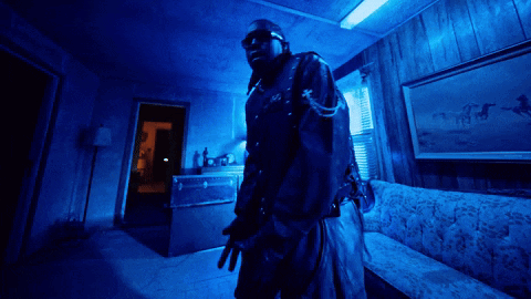 Man In Dark Room With Blue Light GIF