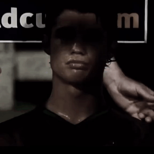 Man in Dark Room With DCUM Sign