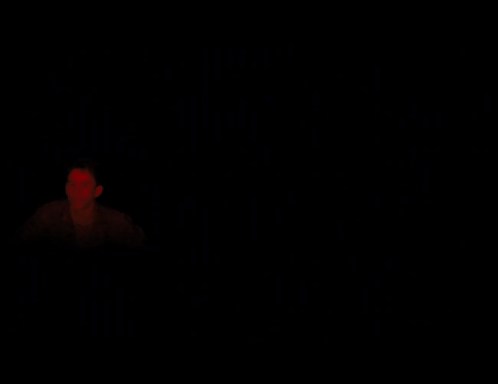 Man In Dark Room With Red Light GIF