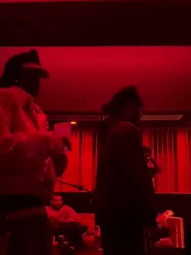 Man in Dark Room With Red Light