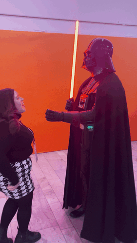 Man in Darth Vader Costume Holding Light Saber