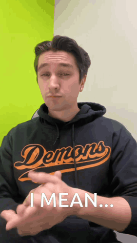 Man in Demons Hoodie Signing I Mean