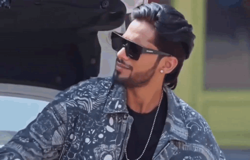 Man In Denim Jacket And Sunglasses Next To Car GIF