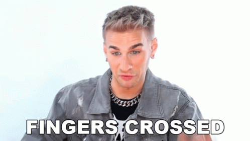 Man In Denim Jacket Crosses Fingers GIF