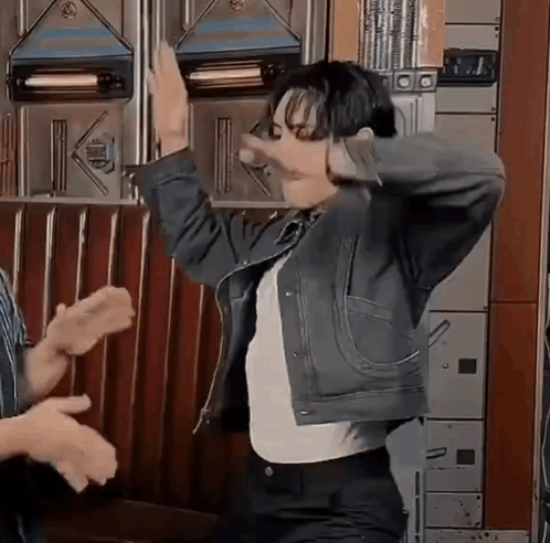 Man In Denim Jacket Dancing With Group GIF