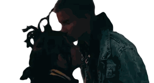 Man in Denim Jacket Kissing Woman