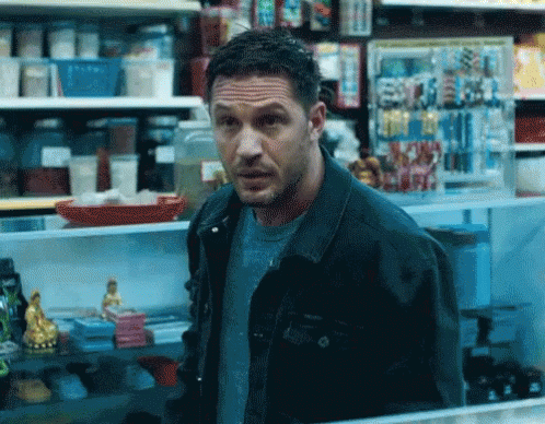 Man In Denim Jacket Looking In Store GIF