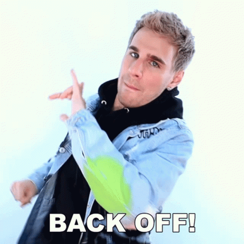 Man in Denim Jacket Pointing Back Off