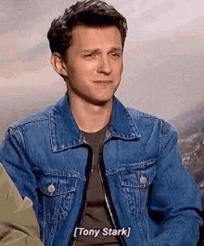 Man In Denim Jacket Talking To Tony Stark GIF