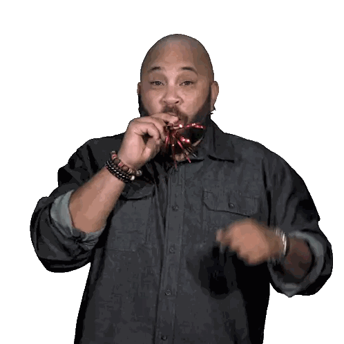 Man in Denim Shirt Blowing Party Horn