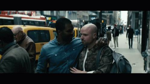 Man in Denim Shirt Hugging Another