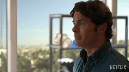 Man in Denim Shirt with Netflix Logo