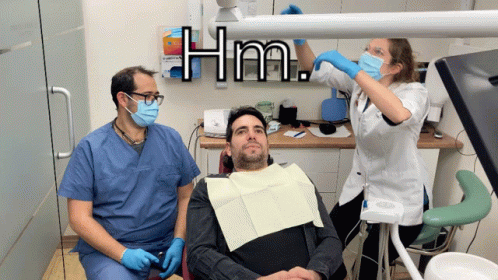 Man In Dental Chair With Two Dentists Hm GIF