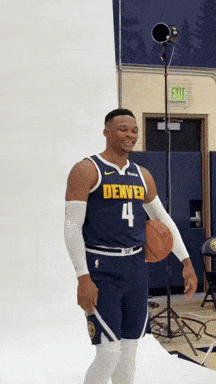 Man In Denver Jersey Number 4 Holding Basketball GIF