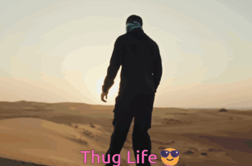 Man In Desert With Thug Life Behind Him GIF