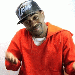 Man in Detroit Lions Hat and Red Jacket Smiling