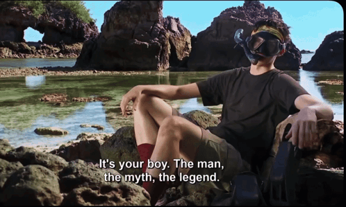 Man in Diving Mask on Rock by Water