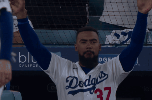 Man in Dodgers Jersey Arms Up