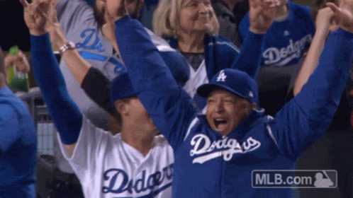 Man in Dodgers Jersey Holding Arms Up