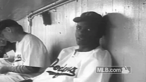 Man in Dodgers Jersey Leaning in Black and White