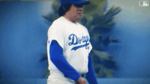 Man in Dodgers Jersey on Baseball Field