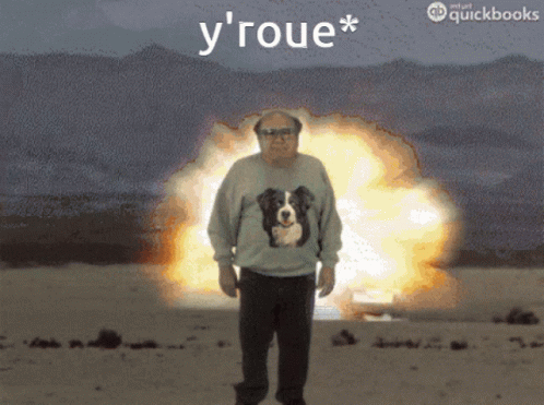 Man In Dog Sweater Standing In Front Of Explosion Saying Y' Roue GIF