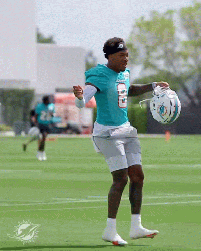 Man In Dolphins Uniform Holding Helmet GIF