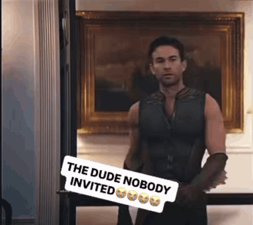 Man In Doorway Sign Says The Dude Nobody Invited GIF