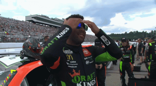 Man In Draft Kings Shirt Adjusting Sunglasses GIF