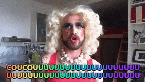 Man In Drag Queen Costume Saying Coucou GIF