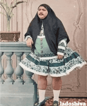Man in Dress Next to Railing Ladoshiva