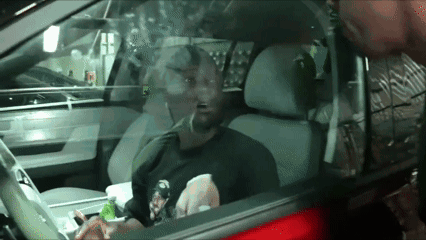 Man in Driver's Seat With Mouth Open