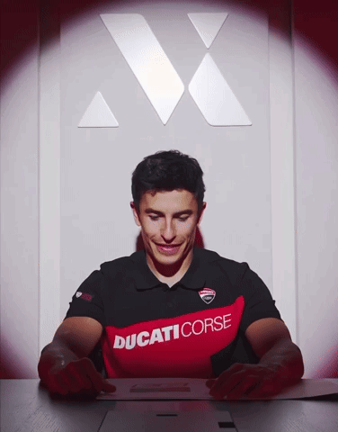 Man in Ducati Corse Shirt Looking Down