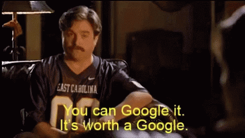 Man in East Carolina Jersey Sitting on Couch