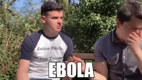 Man in Ebola Shirt Next to Another Man