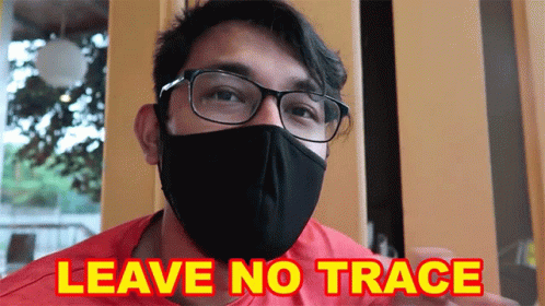 Man in Face Mask and Glasses Says Leave No Trace