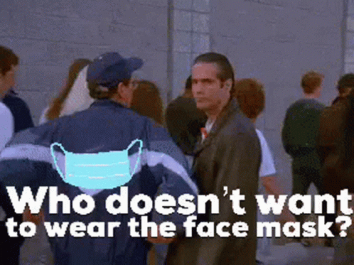 Man In Face Mask Facing Crowd GIF