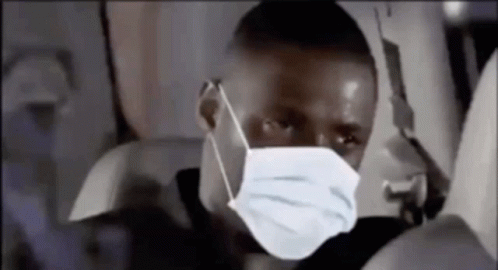 Man in Face Mask Sitting on Plane